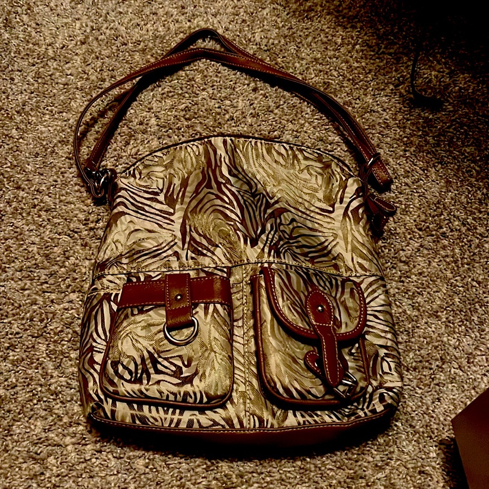 Kim Rogers Brown and Tan purse. Brand new. Haven’t used and perfect condition!